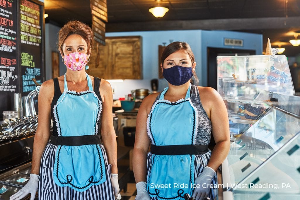 workers pose in aprons and protective masks at Sweet Ride Ice Cream in West Reading, PA