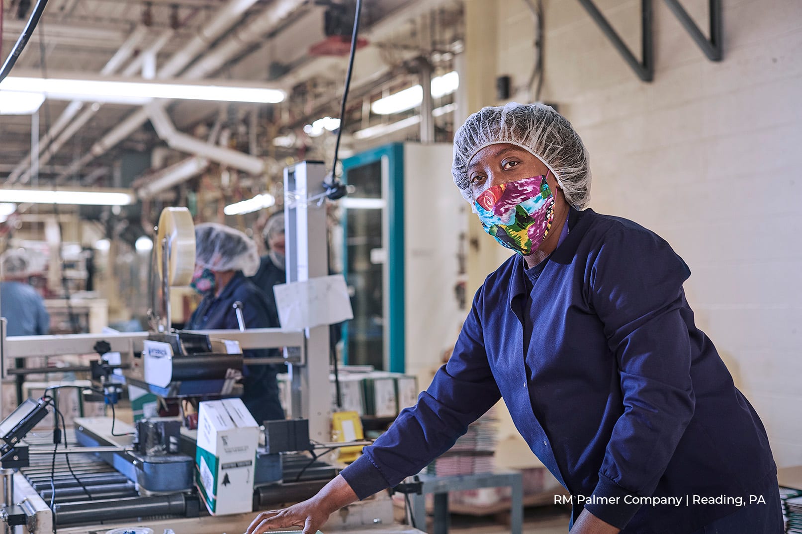 female worker in PPE at RM Palmer Company in Reading, PA