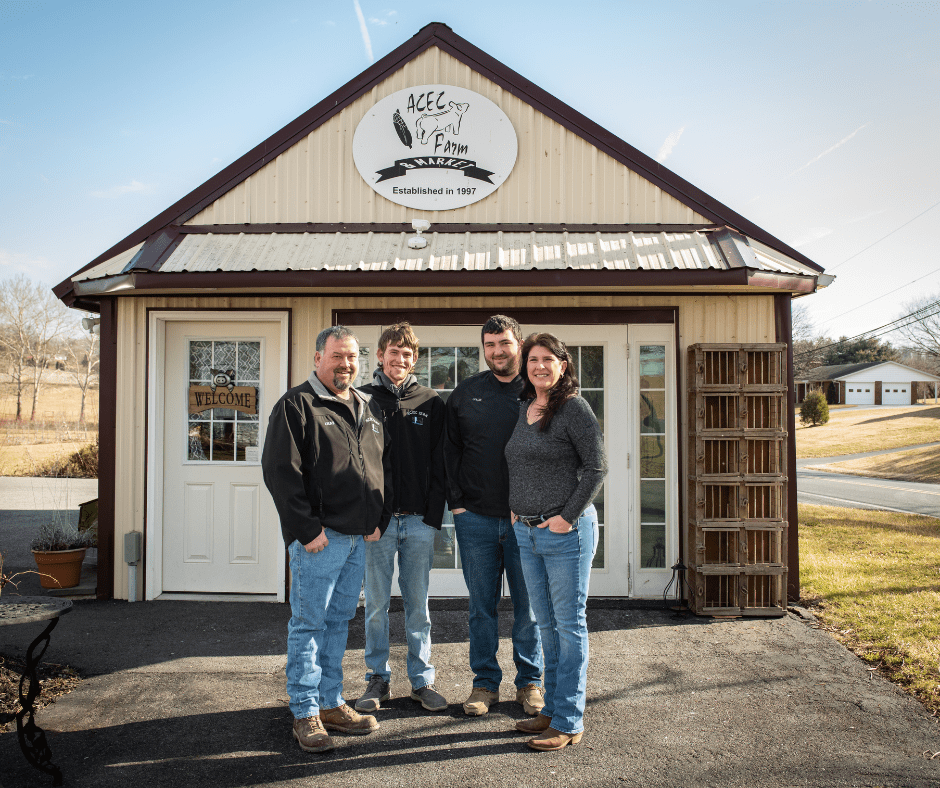 Untitled design – 2023-02-28T095834.167 Kamp family posing in front of the ACEC Farm & Market.